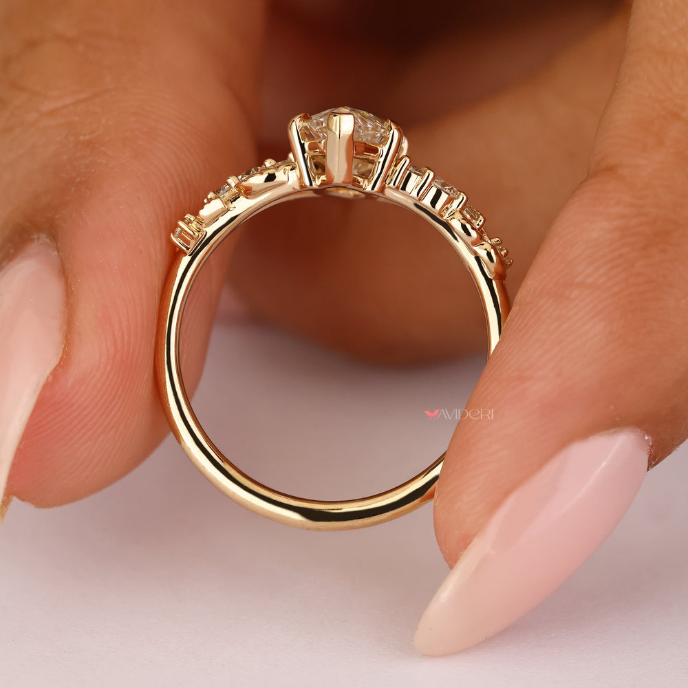 Nature inspired ring with V and claw prongs.
