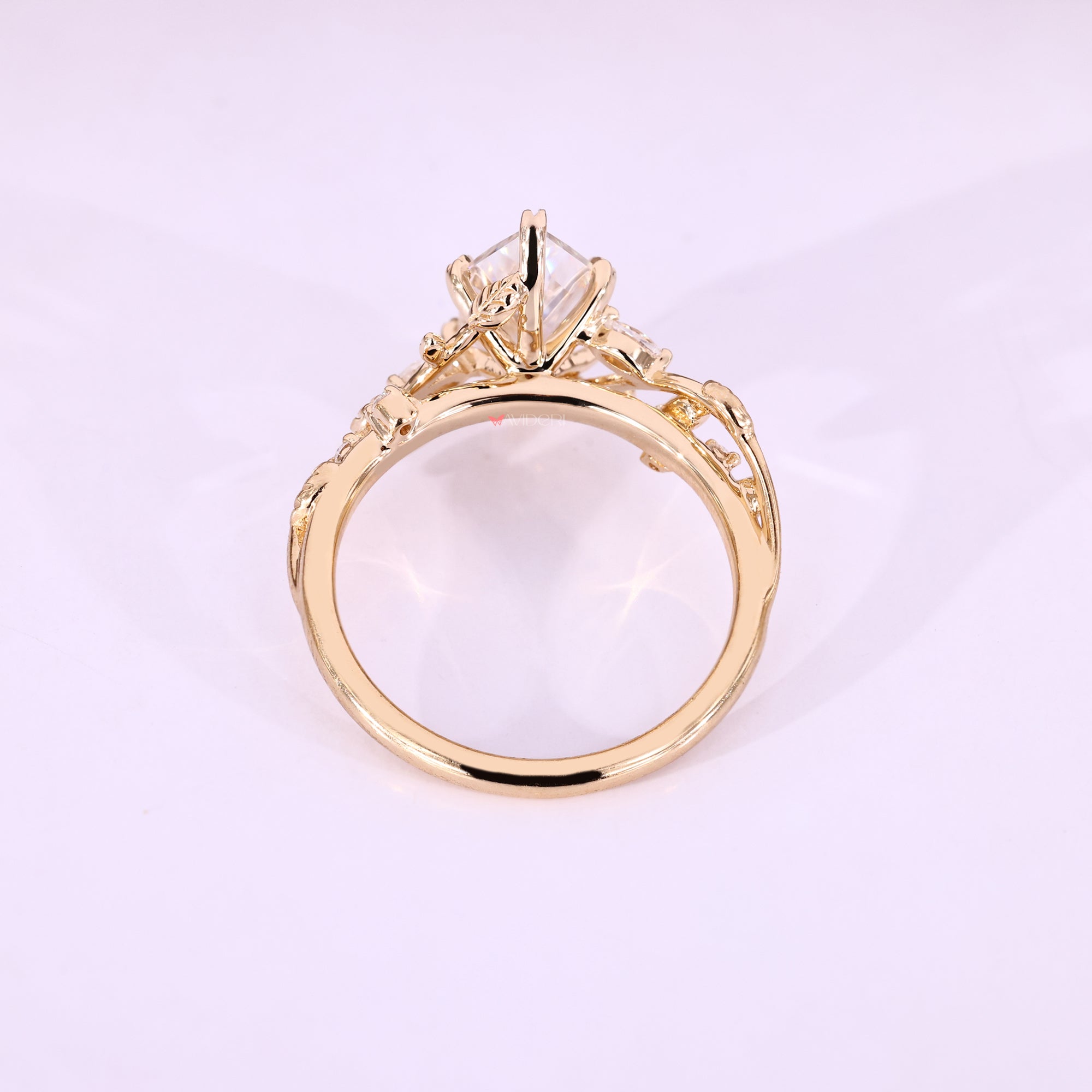 Yellow gold ring with a marquise center stone.