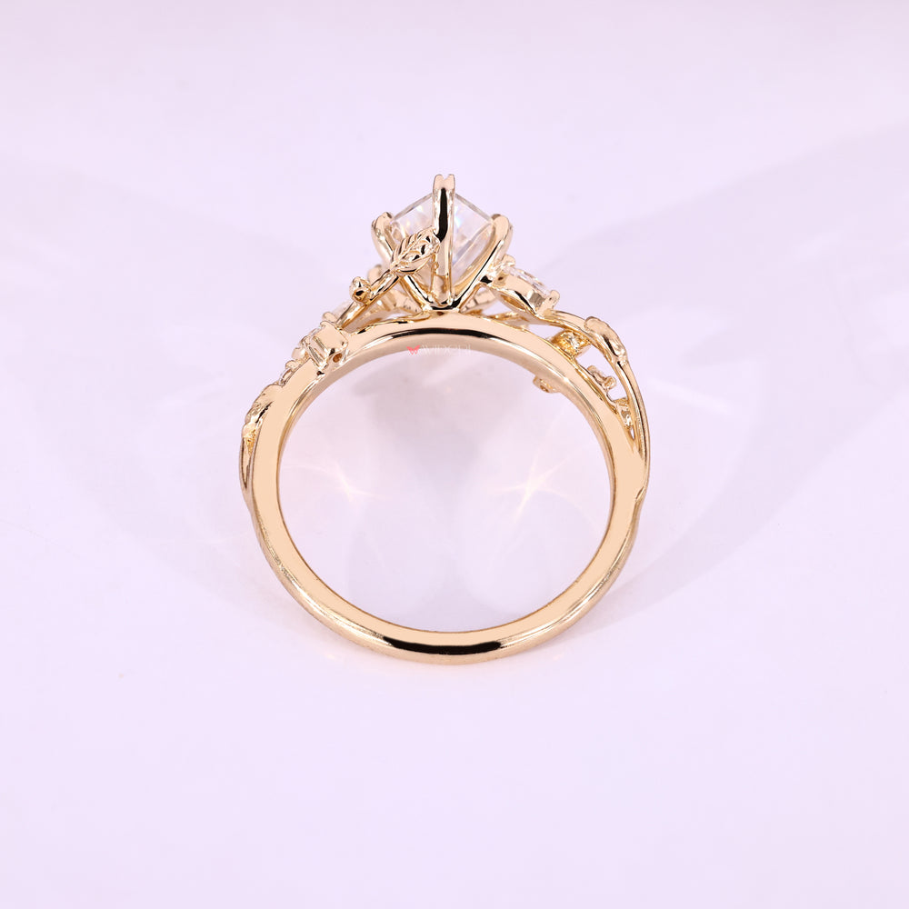 Yellow gold ring with a marquise center stone.