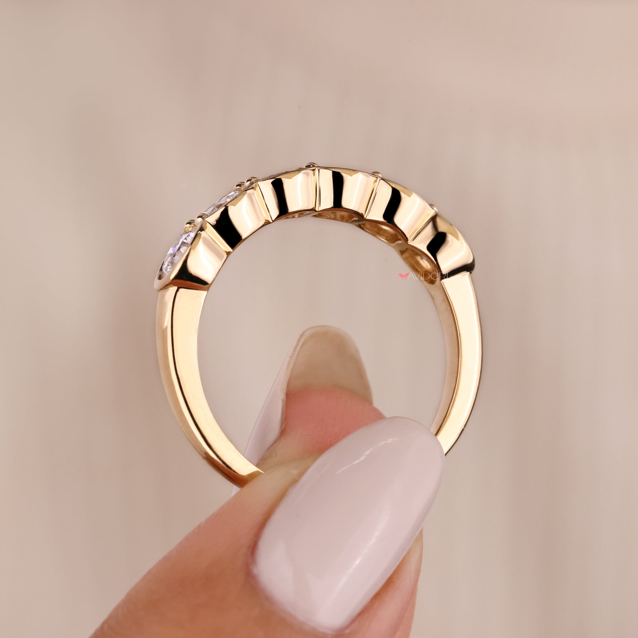 Elegant round diamond band in yellow gold finish.
