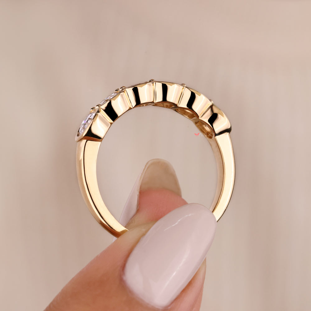 Elegant round diamond band in yellow gold finish.
