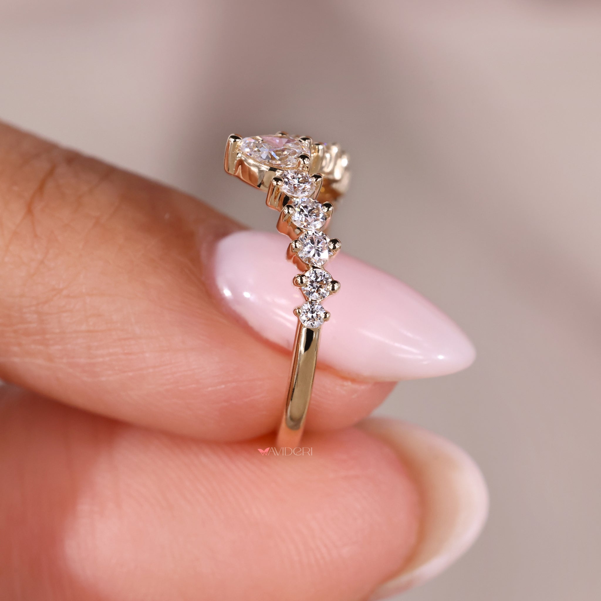 Lab grown diamond pear shaped diamond band for sustainable elegance.

