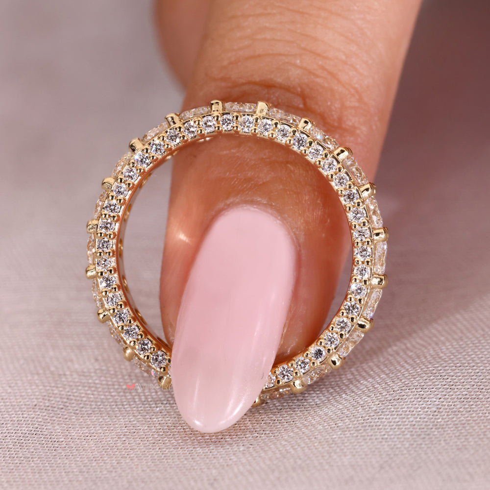 Yellow gold eternity band featuring a stunning round diamond wedding band.
